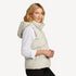 Side view of women’s navy and cream waterproof puffer vest on model – Louvóre apparel